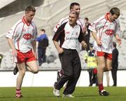 17 July 2004; Tyrone manager Mickey Harte speaks to his players, from left, Michael Coleman, Ryan McMenamin and Shane Sweeney during the warm down. Bank of Ireland Senior Football Championship Qualifier, Round 3, Tyrone v Galway, Croke Park, Dublin. Picture credit; Damien Eagers / SPORTSFILE