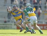 17 July 2004; Andrew Quinn, Clare, in action against Kevin Brady, Offaly. Guinness Senior Hurling Championship Qualifier, Round 3, Clare v Offaly, Gaelic Grounds, Limerick. Picture credit; Brendan Moran / SPORTSFILE