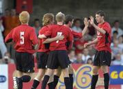 17 July 2004; Manchester United XI players celebrate the opening goal against Cobh Rambler, from left, Paul McShane, 5, goal scorer Mads Timm , Luke Chadwick, 7, Roy Keane and Kenny Cooper. Friendly game, Cobh Ramblers v Manchester United X1, Turners Cross, Cork. Picture credit; Matt Browne / SPORTSFILE