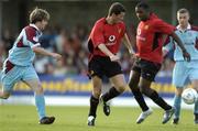 17 July 2004; Roy Keane, Manchester United XI, in action against David Warren,left, Cobh Ramblers also pictured is team-mate Sylvan Ebanks-Blake and Cobh player Eoin Conlon. Friendly game, Cobh Ramblers v Manchester United X1, Turners Cross, Cork. Picture credit; Matt Browne / SPORTSFILE