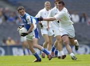 18 July 2004; Craig Rogers, Laois, is tackled by Pauric O'Neill, Kildare. Leinster Minor Football Championship Final, Laois v Kildare, Croke Park, Dublin. Picture credit; Ray McManus / SPORTSFILE