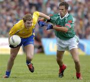 18 July 2004; David Casey, Roscommon, in action against James Gill, Mayo. Bank of Ireland Connacht Senior Football Championship Final, Mayo v Roscommon, McHale Park, Castlebar, Co. Mayo. Picture credit; Damien Eagers / SPORTSFILE