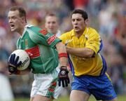 18 July 2004; David Brady, Mayo, in action against Ger Heneghan, Roscommon. Bank of Ireland Connacht Senior Football Championship Final, Mayo v Roscommon, McHale Park, Castlebar, Co. Mayo. Picture credit; Damien Eagers / SPORTSFILE