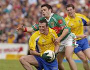 18 July 2004; Andy McPadden, Roscommon, in action against Brian Maloney, Mayo. Bank of Ireland Connacht Senior Football Championship Final, Mayo v Roscommon, McHale Park, Castlebar, Co. Mayo. Picture credit; Pat Murphy / SPORTSFILE