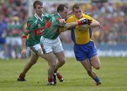 18 July 2004; Gary Cox, Roscommon, in action against Fergal Costello and Ronan McGarrity, left, Mayo. Bank of Ireland Connacht Senior Football Championship Final, Mayo v Roscommon, McHale Park, Castlebar, Co. Mayo. Picture credit; Damien Eagers / SPORTSFILE