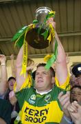 18 July 2004; Kerry captain Dara O'Cinneide lifts the Munster cup after victory over Limerick. Bank of Ireland Munster Senior Football Championship Final Replay, Kerry v Limerick, Fitzgerald Stadium, Killarney, Co. Kerry. Picture credit; Brendan Moran / SPORTSFILE