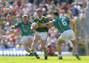 18 July 2004; Dara O'Cinneide, Kerry, in action against Johnny McCarthy, left, and Stephen Lucey, Limerick. Bank of Ireland Munster Senior Football Championship Final Replay, Kerry v Limerick, Fitzgerald Stadium, Killarney, Co. Kerry. Picture credit; Brendan Moran / SPORTSFILE