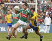 18 July 2004; Ronan McGarrity, Mayo, in action against Francie Grehan, Roscommon. Bank of Ireland Connacht Senior Football Championship Final, Mayo v Roscommon, McHale Park, Castlebar, Co. Mayo. Picture credit; Pat Murphy / SPORTSFILE