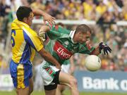 18 July 2004; Trevor Mortimer, Mayo, in action against Francie Grehan, Roscommon. Bank of Ireland Connacht Senior Football Championship Final, Mayo v Roscommon, McHale Park, Castlebar, Co. Mayo. Picture credit; Pat Murphy / SPORTSFILE