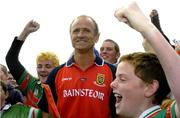 18 July 2004; John Maughan, Mayo manager, celebrates with young Mayo fans after victory over Roscommon. Bank of Ireland Connacht Senior Football Championship Final, Mayo v Roscommon, McHale Park, Castlebar, Co. Mayo. Picture credit; Pat Murphy / SPORTSFILE
