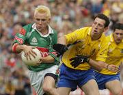 18 July 2004; Conor Mortimer, Mayo, in action against John Whyte, Roscommon. Bank of Ireland Connacht Senior Football Championship Final, Mayo v Roscommon, McHale Park, Castlebar, Co. Mayo. Picture credit; Pat Murphy / SPORTSFILE