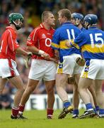 10 July 2004; Diarmuid O'Sullivan, Cork, and Conor Gleeson, Tipperary, square up to each other during the game. Guinness Senior Hurling Championship Qualifier, Round 3, Cork v Tipperary, Fitzgerald Stadium, Killarney, Co. Kerry. Picture credit; Brendan Moran / SPORTSFILE