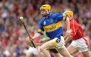 10 July 2004; Eamon Corcoran, Tipperary, in action against Joe Deane, Cork. Guinness Senior Hurling Championship Qualifier, Round 3, Cork v Tipperary, Fitzgerald Stadium, Killarney, Co. Kerry. Picture credit; Brendan Moran / SPORTSFILE