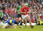 10 July 2004; Niall McCarthy, Cork, in action against Diarmuid Fitzgerald, Tipperary. Guinness Senior Hurling Championship Qualifier, Round 3, Cork v Tipperary, Fitzgerald Stadium, Killarney, Co. Kerry. Picture credit; Brendan Moran / SPORTSFILE