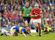 10 July 2004; Niall McCarthy, Cork, in action against Diarmuid Fitzgerald, Tipperary. Guinness Senior Hurling Championship Qualifier, Round 3, Cork v Tipperary, Fitzgerald Stadium, Killarney, Co. Kerry. Picture credit; Brendan Moran / SPORTSFILE