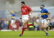 10 July 2004; Sean Og O'hAilpin, Cork, in action against Paul Kelly, Tipperary. Guinness Senior Hurling Championship Qualifier, Round 3, Cork v Tipperary, Fitzgerald Stadium, Killarney, Co. Kerry. Picture credit; Brendan Moran / SPORTSFILE
