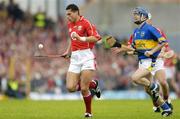 10 July 2004; Sean Og O'hAilpin, Cork, in action against Paul Kelly, Tipperary. Guinness Senior Hurling Championship Qualifier, Round 3, Cork v Tipperary, Fitzgerald Stadium, Killarney, Co. Kerry. Picture credit; Brendan Moran / SPORTSFILE
