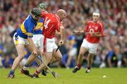 10 July 2004; Brian Corcoran, Cork, in action against Philip Maher, Tipperary. Guinness Senior Hurling Championship Qualifier, Round 3, Cork v Tipperary, Fitzgerald Stadium, Killarney, Co. Kerry. Picture credit; Brendan Moran / SPORTSFILE