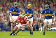 10 July 2004; Niall McCarthy, Cork, in action against Declan Fanning, left, Eamonn Corcoran and Martin Maher, Tipperary. Guinness Senior Hurling Championship Qualifier, Round 3, Cork v Tipperary, Fitzgerald Stadium, Killarney, Co. Kerry. Picture credit; Brendan Moran / SPORTSFILE