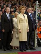 11 July 2004; President Mary McAleese stands for the Presidential salute accompanied by her husband Martin, left, and Sean Fogarty, Chairman of the Munster Council. Bank of Ireland Munster Senior Football Championship Final, Limerick v Kerry, Gaelic Grounds, Limerick. Picture credit; Brendan Moran / SPORTSFILE