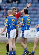 10 July 2004; Referee Michael Curley has a word with Trevor Smullen, Longford, 12, and Dermot Brady, 2. Bank of Ireland Senior Football Championship Qualifier, Round 3, Dublin v Longford, O'Moore Park, Portlaoise, Co. Laois. Picture credit; Ray McManus / SPORTSFILE