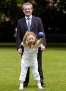 20 July 2004; Dr Phil Nolan, CEO of eircom, with Special Olympics Ireland athlete Helena Roche, aged 9, from Raheny, a member of Bayside Gym Club, who's demonstrating Bocce, one of two new sports to Special Olympics Ireland, at a photocall to celebrate eircom's 19 year support of the programme and announce details of eircom's continuing premier sponsorship of Special Olympics Ireland. Dublin. Picture credit; Damien Eagers / SPORTSFILE