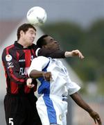 20 July 2004; Barry Ferguson, Longford Town, in action against Eloka Asokuh, Finn Harps. eircom League Cup Semi-Final, Finn Harps v Longford Town, Finn Park, Ballybofey, Co. Donegal. Picture credit; David Maher / SPORTSFILE