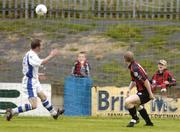 20 July 2004; Sean Francis, right, Longford Town, scores his sides first  goal desipe the challange from Finn Harps's Jonathan Minnock. eircom League Cup Semi-Final, Finn Harps v Longford Town, Finn Park, Ballybofey, Co. Donegal. Picture credit; David Maher / SPORTSFILE