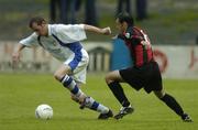 20 July 2004; Jonathan Minnock, Finn Harps, in action against John Martin, Longford Town. eircom League Cup Semi-Final, Finn Harps v Longford Town, Finn Park, Ballybofey, Co. Donegal. Picture credit; David Maher / SPORTSFILE