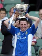 18 July 2004; Craig Rogers, Laois captain, lifts the cup after victory in the final. Leinster Minor Football Championship Final, Laois v Kildare, Croke Park, Dublin. Picture credit; Brian Lawless / SPORTSFILE