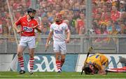 8 September 2013; Darach Honan, Clare, lies injured on the field, watched by Shane O'Neill, Cork. Both players were subsequently shown a yellow card by referee Brian Gavin. GAA Hurling All-Ireland Senior Championship Final, Cork v Clare, Croke Park, Dublin. Picture credit: Brendan Moran / SPORTSFILE