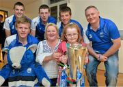 9 September 2013; Zoe Connolly, aged 5, from Dunmore-East, Co. Waterford, holds the Irish Press cup with her mother Mary and Waterford players, from left, Tom Devine, Patrick Curran, Shane Bennett, Kevin Daly and manager Seán Power on a visit by the All-Ireland Minor Hurling Champions to Our Lady's Hospital for Sick Children, Crumlin. Picture credit: Barry Cregg / SPORTSFILE