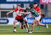 30 January 2024; Eoghan O'Hanlon of CBC Monkstown is tackled by Cian Geraghty of St Gerard's School during the Bank of Ireland Leinster Schools Senior Cup first round match between CBC Monkstown and St Gerard's School at Energia Park in Dublin. Photo by Ben McShane/Sportsfile