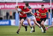 30 January 2024; Milo Quinn of CBC Monkstown is tackled by Ross McCrea of St Gerard's School during the Bank of Ireland Leinster Schools Senior Cup first round match between CBC Monkstown and St Gerard's School at Energia Park in Dublin. Photo by Ben McShane/Sportsfile