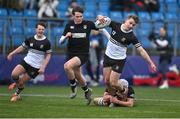 31 January 2024; Paddy Taylor of Newbridge College is tackled by Joe Finn of Cistercian College Roscrea during the Bank of Ireland Leinster Schools Senior Cup First Round match between Newbridge College and Cistercian College Roscrea at Energia Park in Dublin. Photo by David Fitzgerald/Sportsfile