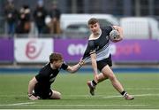 31 January 2024; Paddy Taylor of Newbridge College is tackled by Robert Carney of Cistercian College Roscrea during the Bank of Ireland Leinster Schools Senior Cup First Round match between Newbridge College and Cistercian College Roscrea at Energia Park in Dublin. Photo by David Fitzgerald/Sportsfile