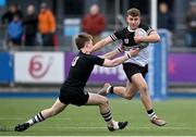 31 January 2024; Paddy Taylor of Newbridge College is tackled by Robert Carney of Cistercian College Roscrea during the Bank of Ireland Leinster Schools Senior Cup First Round match between Newbridge College and Cistercian College Roscrea at Energia Park in Dublin. Photo by David Fitzgerald/Sportsfile