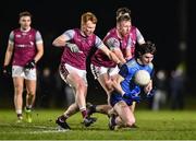 31 January 2024; Diarmuid Moriarty of UCD in action against Evan Lyons, 3, and Ryan O'Donoghue of University of Galway during the Electric Ireland Higher Education GAA Sigerson Cup quarter-final match between University of Galway and UCD at Dangan in Galway.  Photo by Piaras Ó Mídheach/Sportsfile