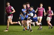31 January 2024; David Garland of UCD in action against Colin Murray of University of Galway during the Electric Ireland Higher Education GAA Sigerson Cup quarter-final match between University of Galway and UCD at Dangan in Galway.  Photo by Piaras Ó Mídheach/Sportsfile