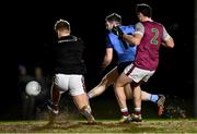 31 January 2024; University of Galway goalkeeper Rory Egan makes a save from David Garland of UCD during the Electric Ireland Higher Education GAA Sigerson Cup quarter-final match between University of Galway and UCD at Dangan in Galway.  Photo by Piaras Ó Mídheach/Sportsfile