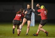 31 January 2024; Sadbh Furlong of Metroin action against Molly Whately, left,  and Chloe Ericson of North East during the BearingPoint Sarah Robinson Cup round four match between North East and Metro at Skerries RFC in Skerries, Dublin. Photo by Sam Barnes/Sportsfile
