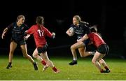 31 January 2024; Libby O'Gorman of Metro is tackled by Molly Whately of North East during the BearingPoint Sarah Robinson Cup round four match between North East and Metro at Skerries RFC in Skerries, Dublin. Photo by Sam Barnes/Sportsfile