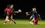31 January 2024; Libby O'Gorman of Metro off-loads the ball as she is tackled by Molly Whately of North East during the BearingPoint Sarah Robinson Cup round four match between North East and Metro at Skerries RFC in Skerries, Dublin. Photo by Sam Barnes/Sportsfile