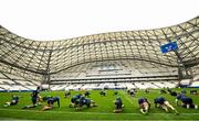 1 February 2024; Ireland players stretch during an Ireland Rugby captain's run at the Stade Velodrome in Marseille, France. Photo by Harry Murphy/Sportsfile