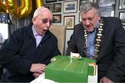 1 February 2024; FAI president Paul Cooke presents a birthday cake to former kit man, referee and legislator, Charlie O'Leary on the occasion of his 100th birthday. Photo by Ray McManus/Sportsfile