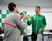 2 February 2024; Sebastian Ofner of Austria, left, and Michael Agwi of Ireland exchange gifts during the Davis Cup World Group I Play-off 1st Round draw ceremony ahead of the match between Ireland and Austria at the UL Sport Arena in Limerick. Photo by Brendan Moran/Sportsfile