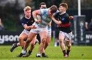 2 February 2024; Niall Smyth of Blackrock College is tackled by Adam Jordan, left, and Evan Kelleher of The High School during the Bank of Ireland Leinster Schools Senior Cup First Round match between The High School and Blackrock College at Ollie Campbell Park in Dublin. Photo by Tyler Miller/Sportsfile