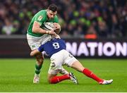 2 February 2024; Robbie Henshaw of Ireland is tackled by Maxime Lucu of France during the Guinness Six Nations Rugby Championship match between France and Ireland at the Stade Velodrome in Marseille, France. Photo by Ramsey Cardy/Sportsfile