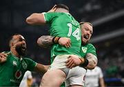 2 February 2024; Calvin Nash of Ireland, 14, celebrates with team-mates Andrew Porter, right, and Jamison Gibson-Park after scoring his side's third try during the Guinness Six Nations Rugby Championship match between France and Ireland at the Stade Velodrome in Marseille, France. Photo by Harry Murphy/Sportsfile