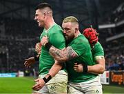 2 February 2024; Dan Sheehan of Ireland, left, celebrates with team-mates Andrew Porter, centre, and Josh van der Flier after scoring their side's fourth try during the Guinness Six Nations Rugby Championship match between France and Ireland at the Stade Velodrome in Marseille, France. Photo by Harry Murphy/Sportsfile
